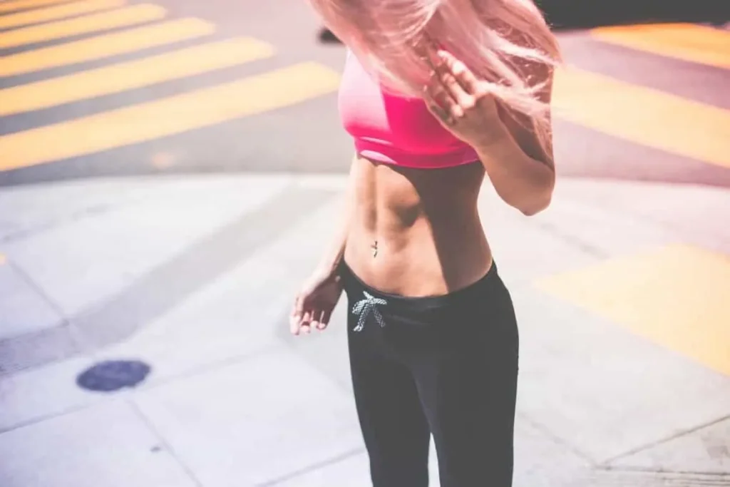 Woman with toned stomach after LA-EMS Body Sculpting Treatment Upper Edmonton
